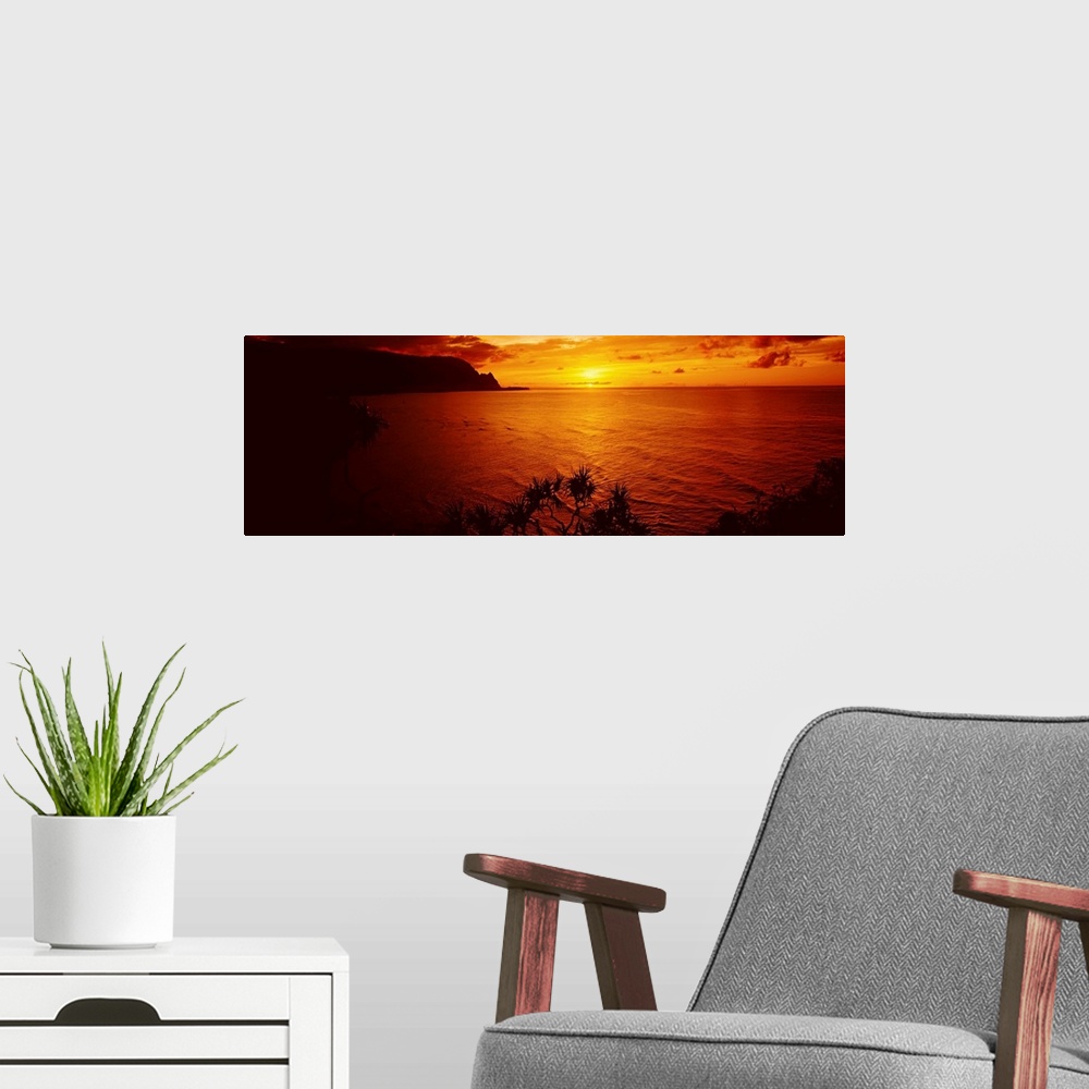 A modern room featuring Sunset over an ocean, Hanalei Bay, Kauai, Hawaii