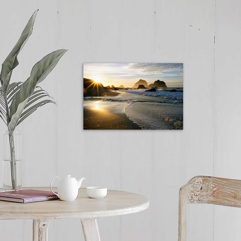 A farmhouse room featuring Panoramic photograph displaying a sunset over an ocean and sandy beach.  In the background you ca...