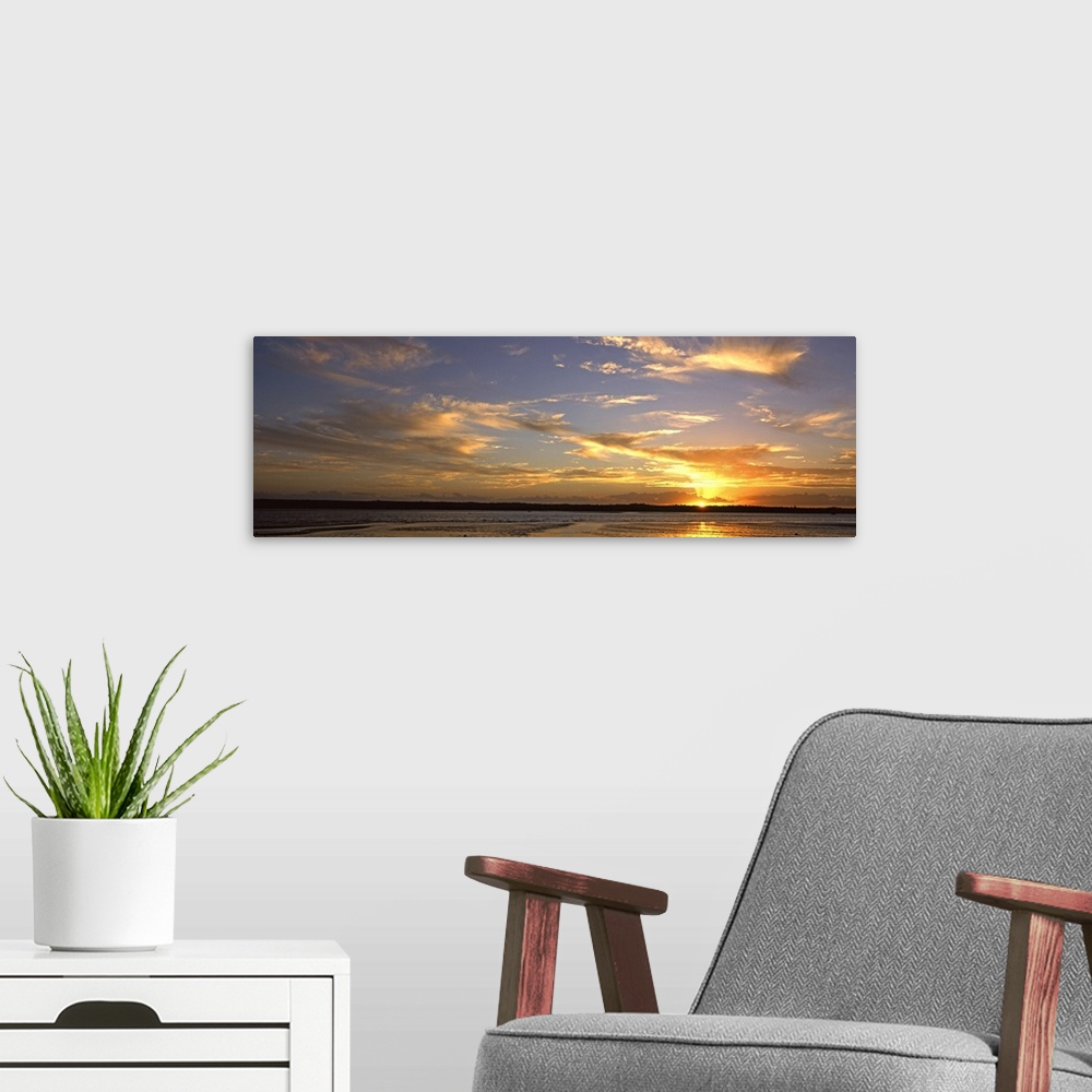 A modern room featuring Sunset over lagoon, Pomene, Mozambique