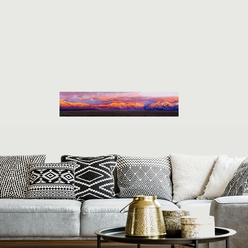 A bohemian room featuring Sunset over mountain range, Sangre De Cristo Mountains, Taos, Taos County, New Mexico, USA