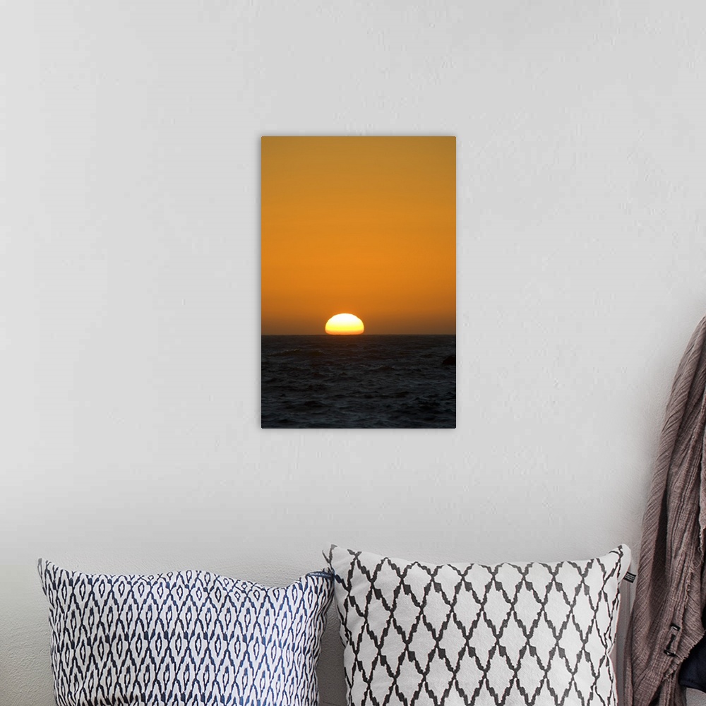 A bohemian room featuring Sunset Over Pacific Ocean