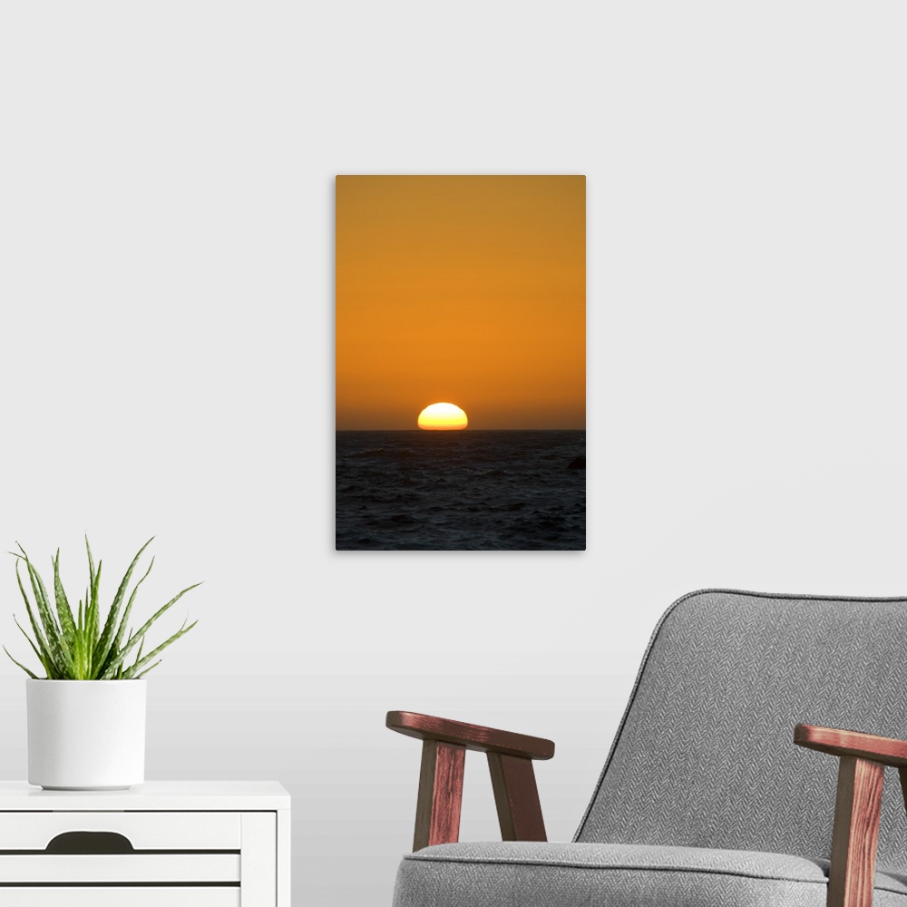 A modern room featuring Sunset Over Pacific Ocean