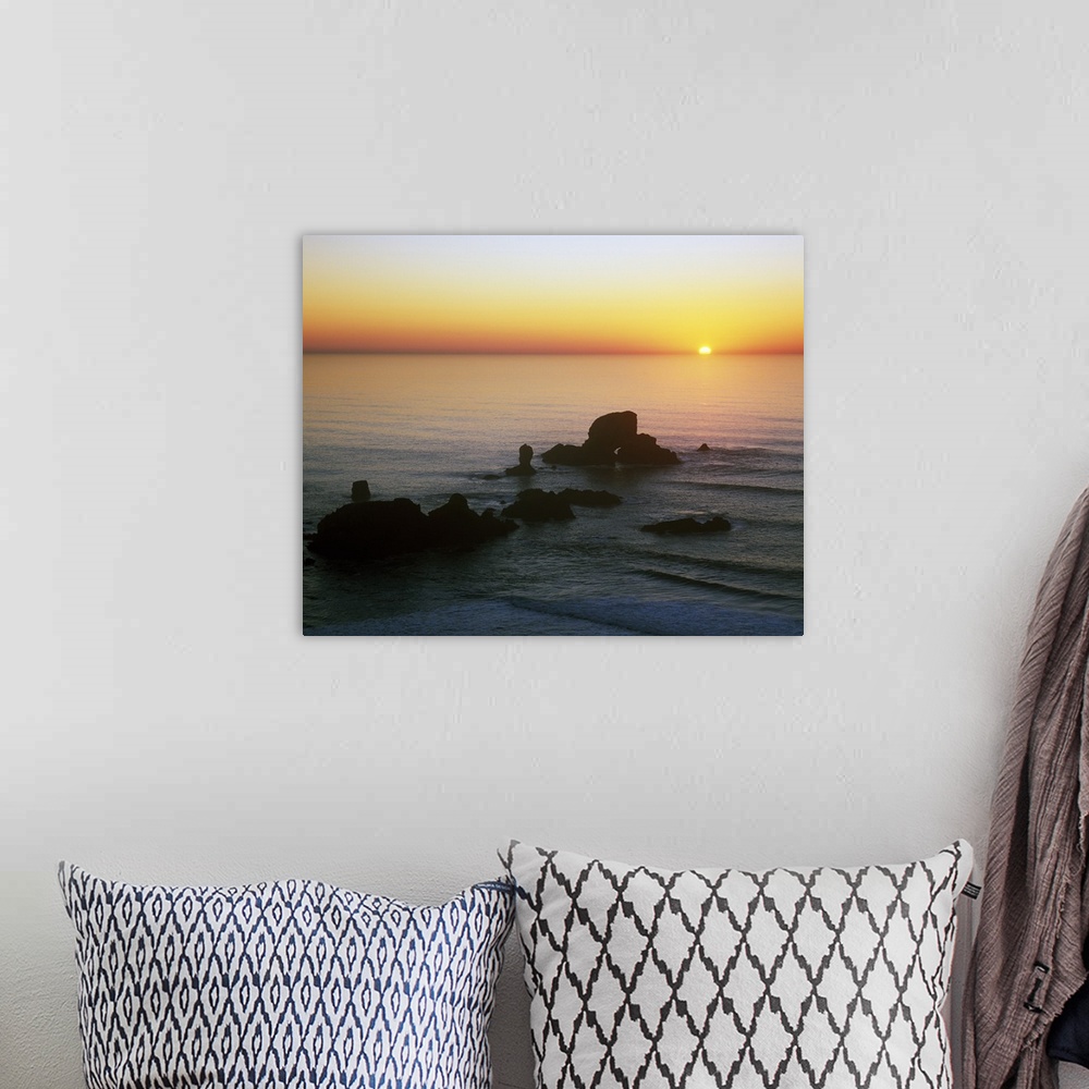 A bohemian room featuring Sunset Over Sea Lion Rock