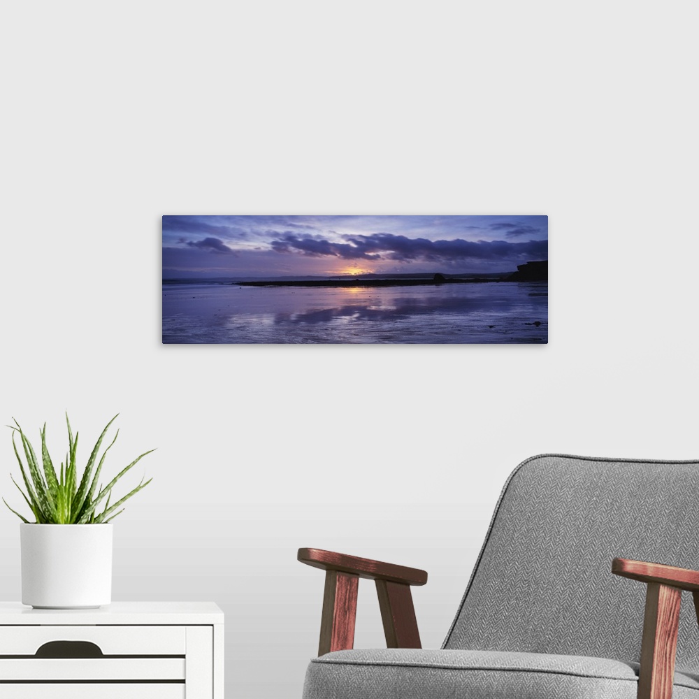 A modern room featuring Sunset over the sea, Exmouth beach, Devon, England