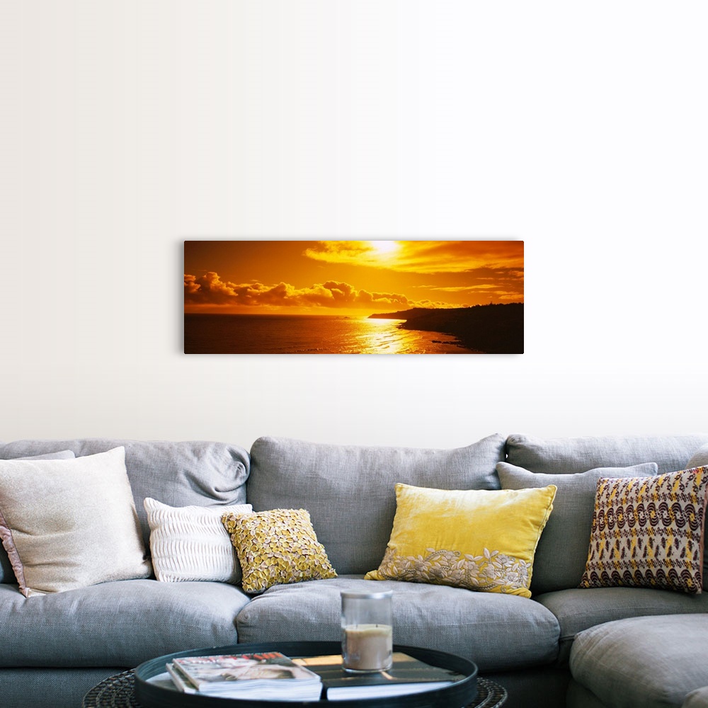A farmhouse room featuring This photograph is a panoramic seascape of the sun reflecting off the shallow beach water as it s...