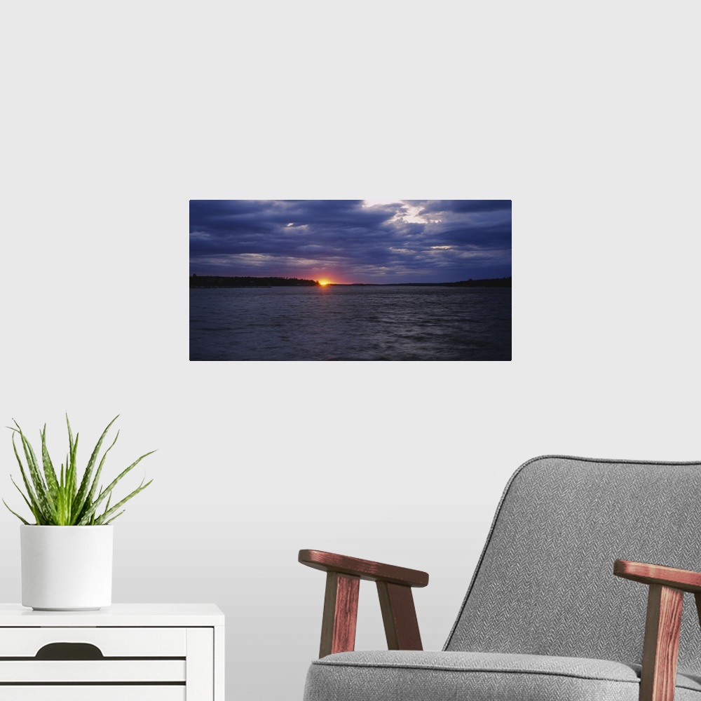 A modern room featuring Sunset over the sea, Sweden