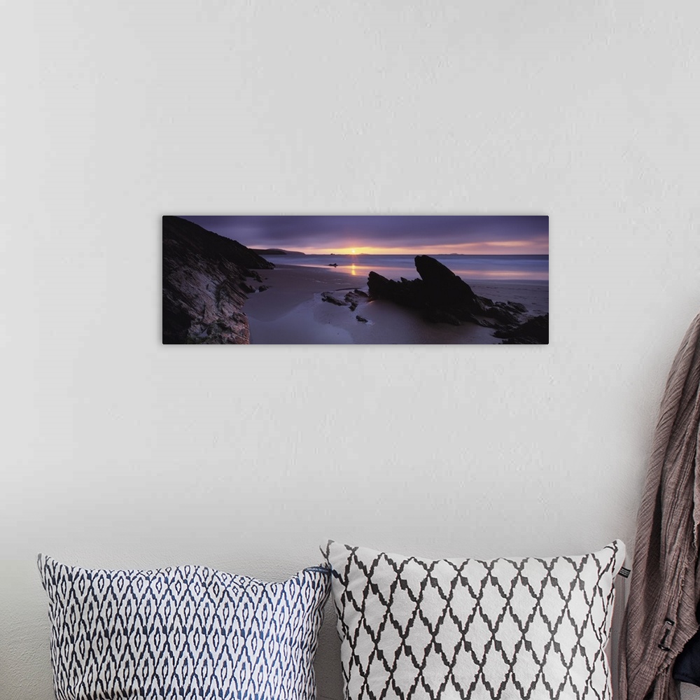 A bohemian room featuring Sunset over the sea Whitesand Bay Pembrokeshire Wales