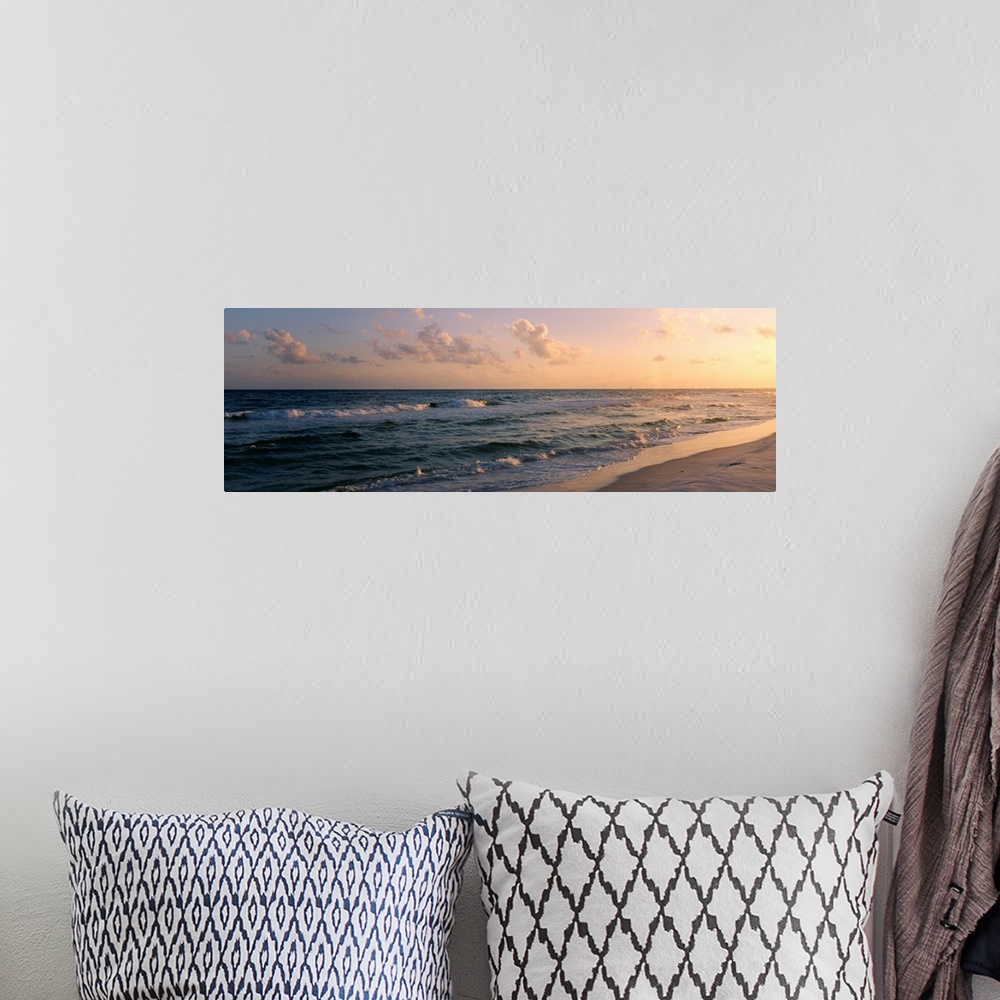 A bohemian room featuring Panoramic photograph showcases waves of the Atlantic Ocean making their way to the Florida shore ...