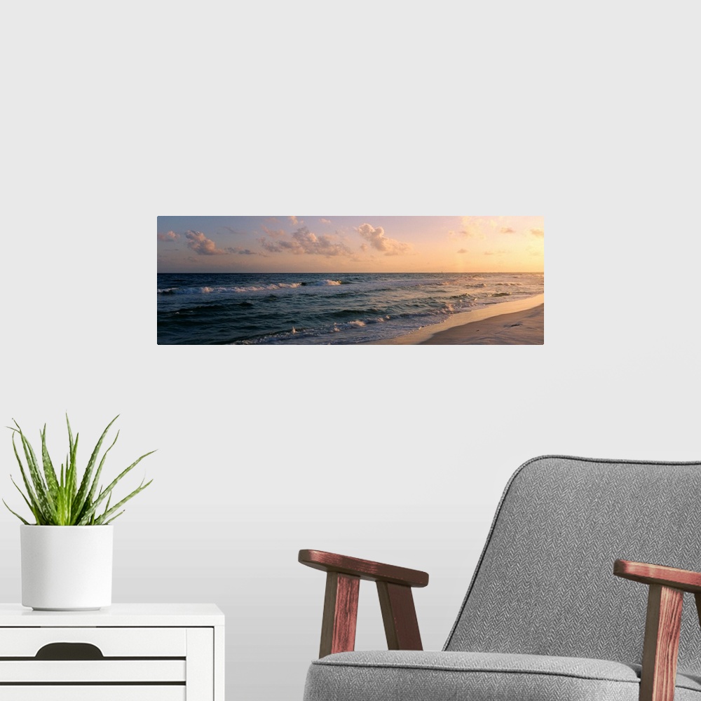 A modern room featuring Panoramic photograph showcases waves of the Atlantic Ocean making their way to the Florida shore ...