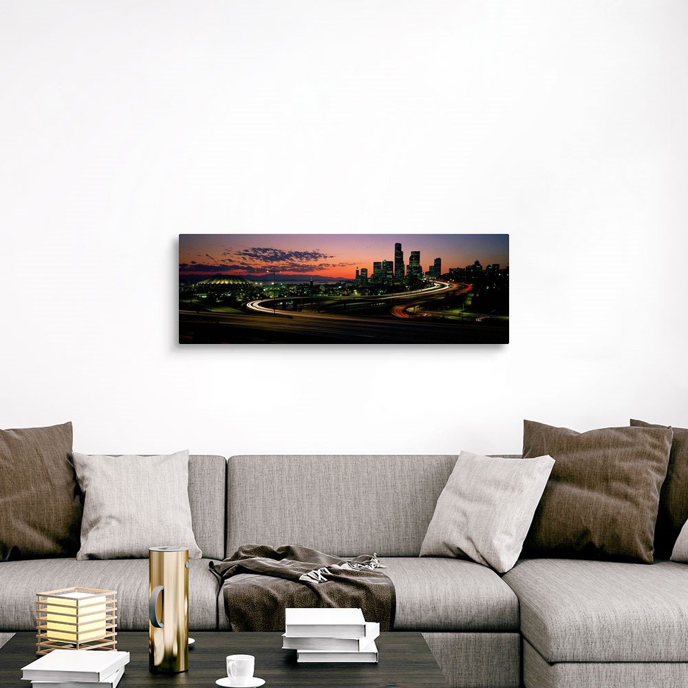 A traditional room featuring Panoramic photograph emphasizes the sun as it begins to set over the busy skyline of a city in th...