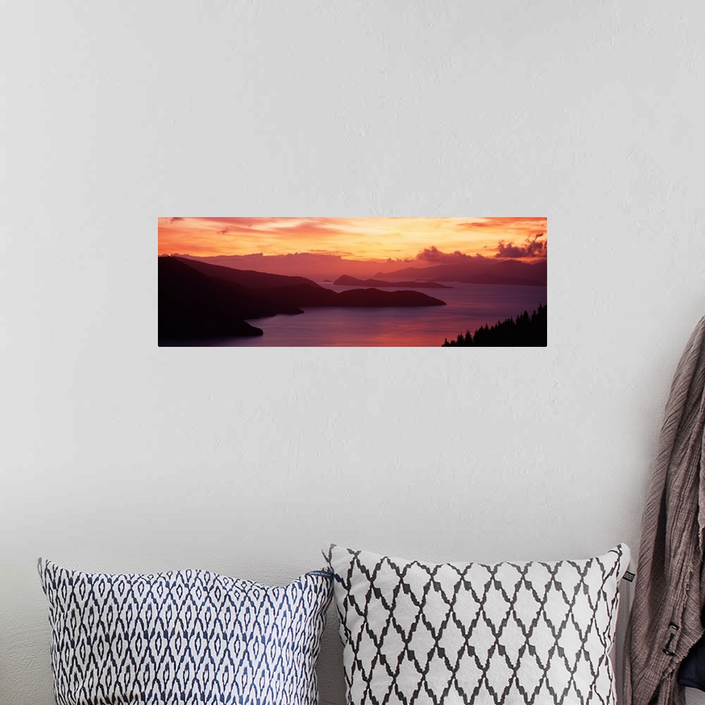 A bohemian room featuring Sunset Queen Charlotte Sound New Zealand