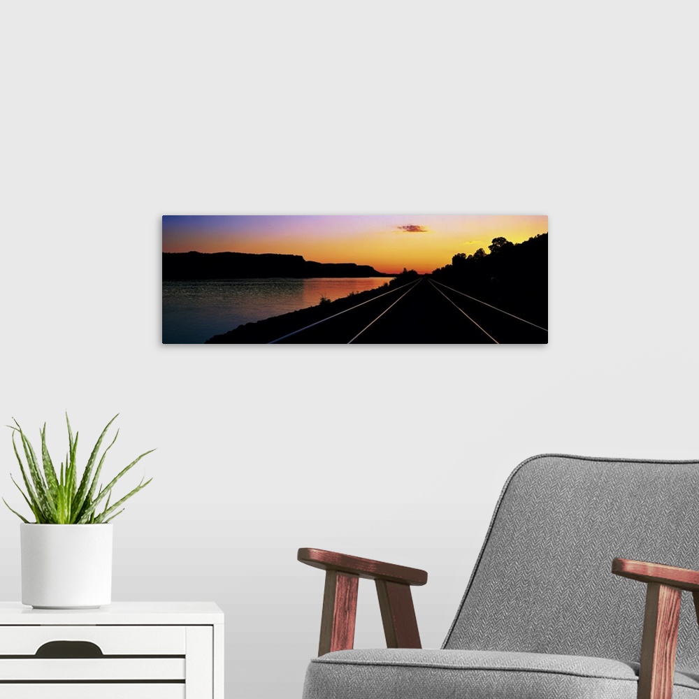 A modern room featuring Sunset Railroad Tracks