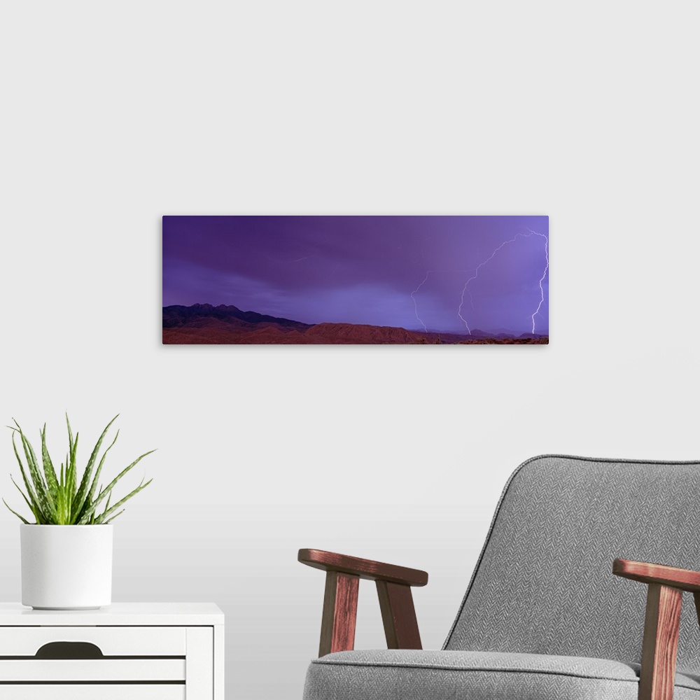 A modern room featuring Sunset w/Lightning Four Peaks Mountain AZ
