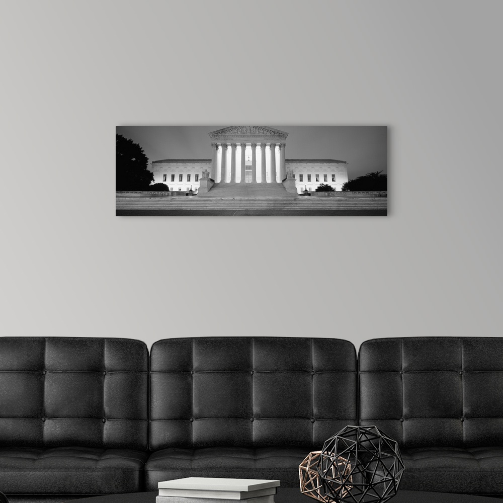 A modern room featuring Supreme Court Building illuminated at night, Washington DC