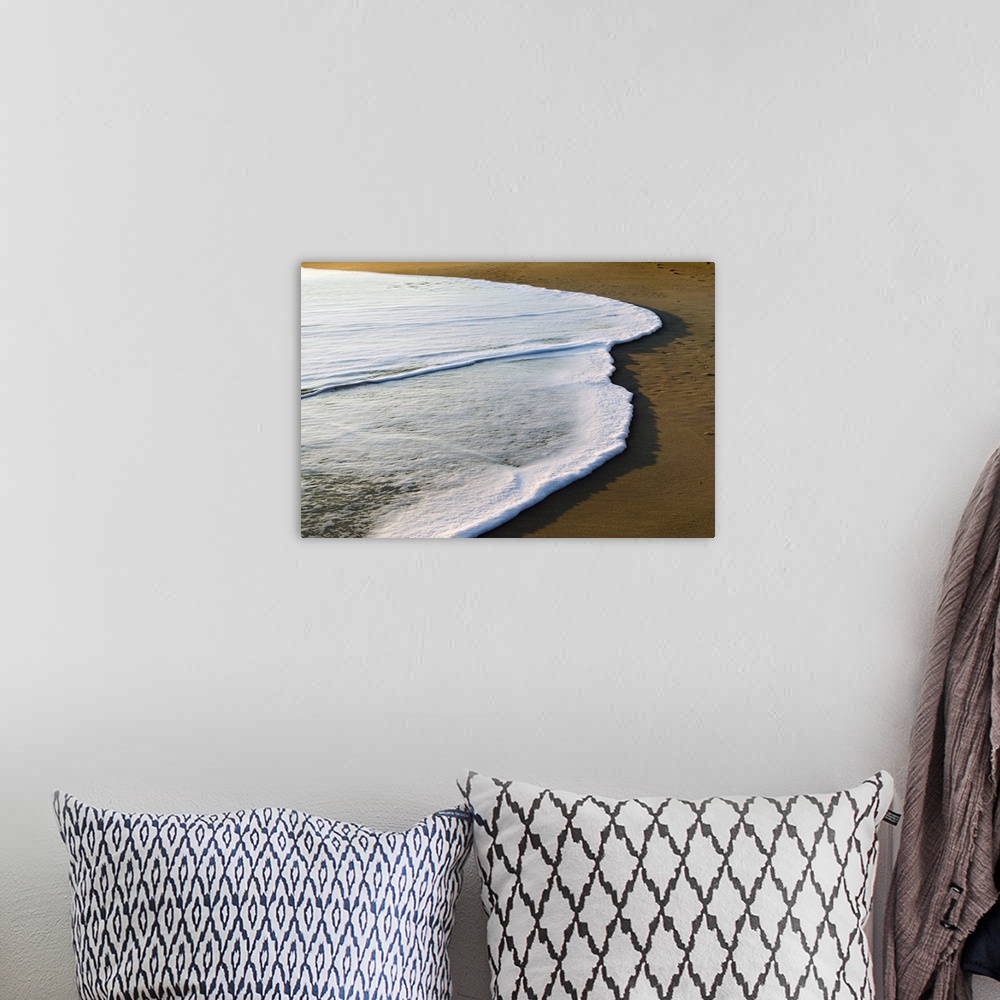 A bohemian room featuring Horizontal, large photograph of the white surf covering part of the sand on a beach of the Outer ...