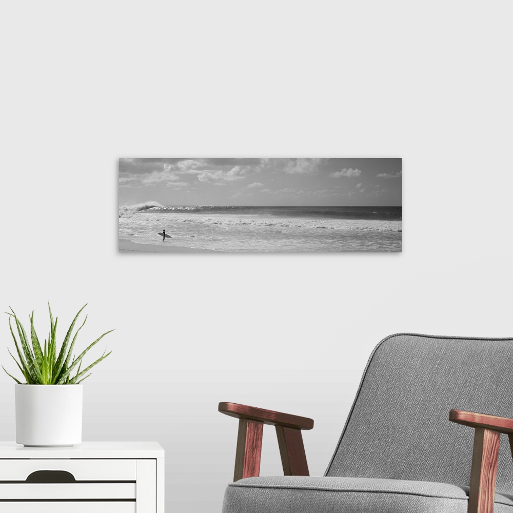 A modern room featuring Surfer standing on the beach, North Shore, Oahu, Hawaii