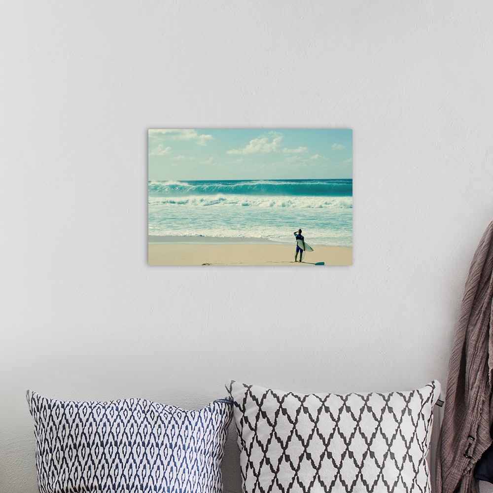 A bohemian room featuring Surfer standing on the beach, North Shore, Oahu, Hawaii, USA