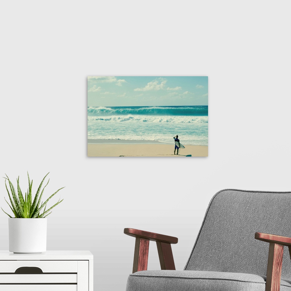 A modern room featuring Surfer standing on the beach, North Shore, Oahu, Hawaii, USA