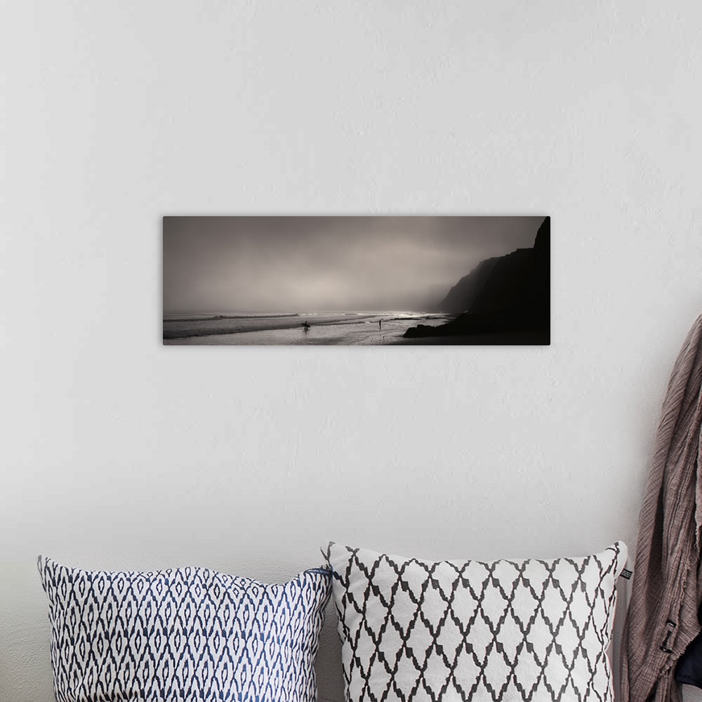 A bohemian room featuring Panoramic photograph on a giant canvas of a dark, foggy sky over Point Reyes National Seashore, w...