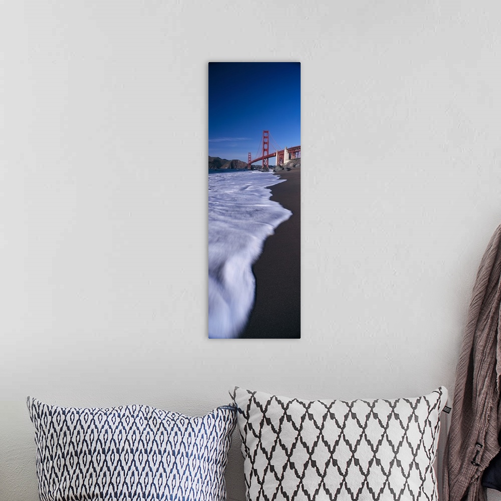 A bohemian room featuring Large, vertical photograph looking down the shoreline of the San Francisco Bay, the Golden Gate B...