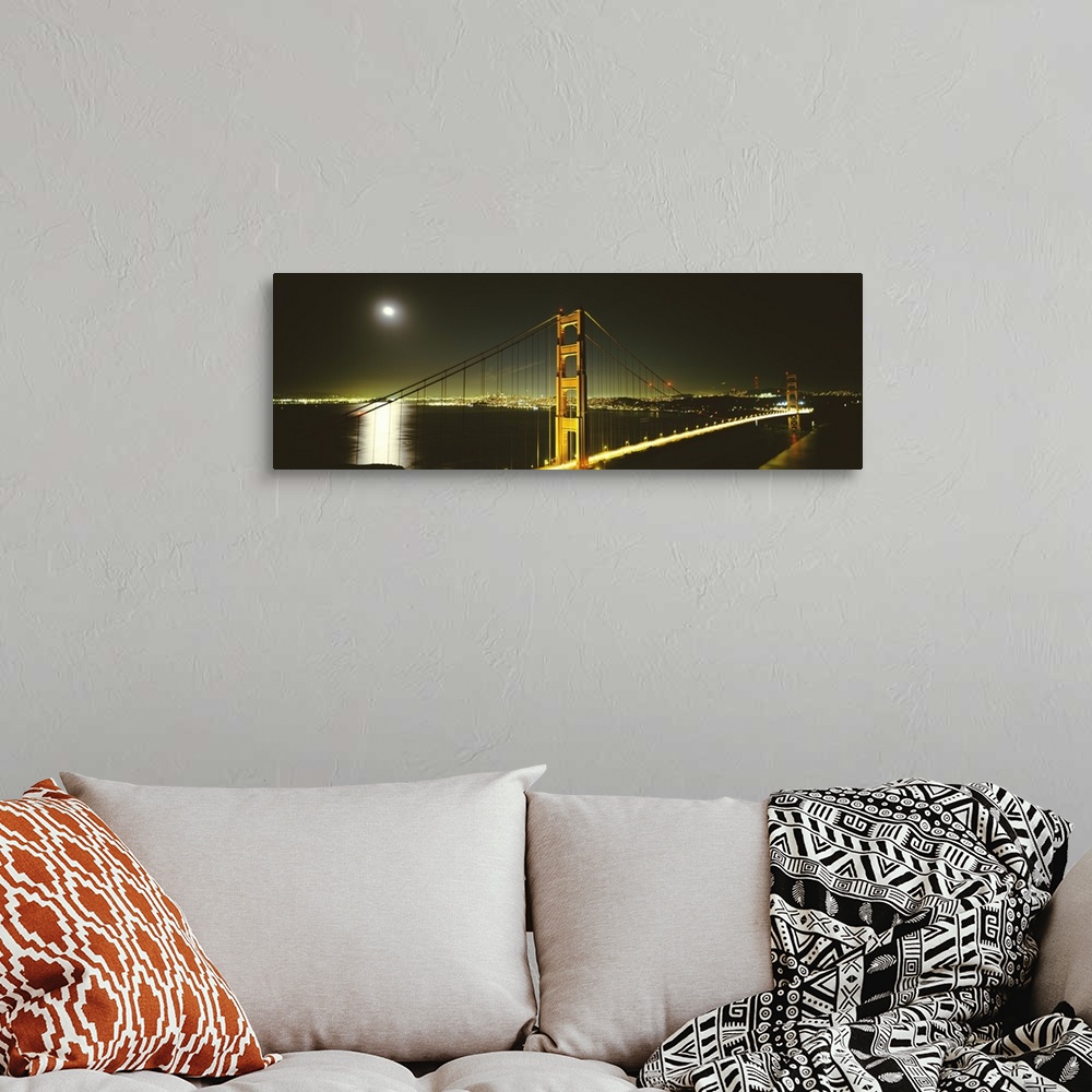 A bohemian room featuring Giant panoramic photograph of the Golden Gate Bridge at night, the moonlight reflecting in the wa...