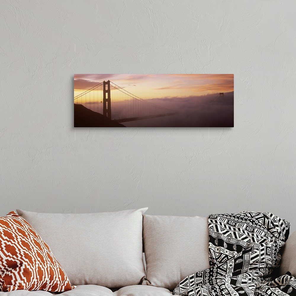 A bohemian room featuring Panoramic photo on canvas of the silhouette of the Golden Gate Bridge coming out of the fog at su...