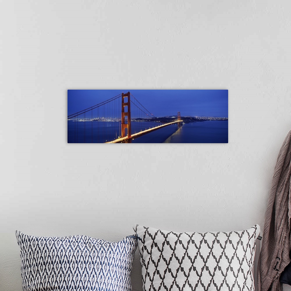 A bohemian room featuring Panoramic photo of a bridge spanning the bay, its famous red towers and cables standing out again...