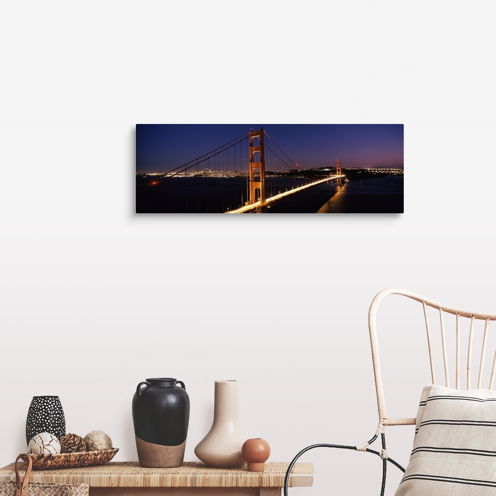 A farmhouse room featuring Panoramic photograph of overpass at night with the city skyline in the distance.  The overpass is...