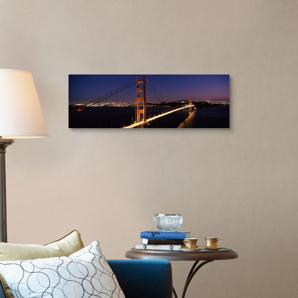 A traditional room featuring Panoramic photograph of overpass at night with the city skyline in the distance.  The overpass is...