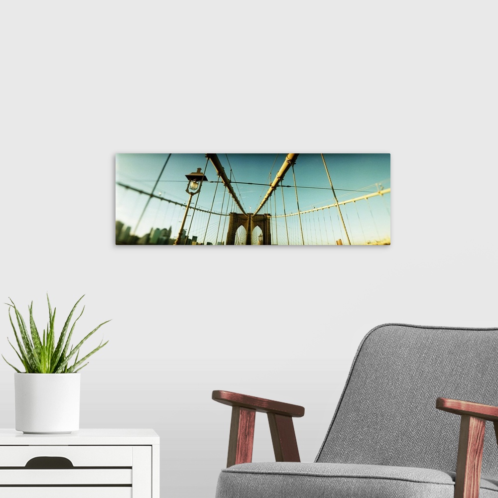 A modern room featuring Suspension bridge with a city in the background Brooklyn Bridge Manhattan New York City New York ...