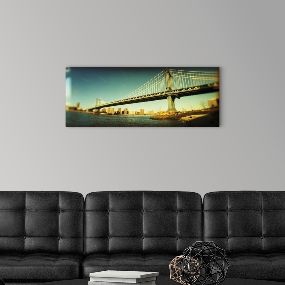 A modern room featuring Suspension bridge with a city in the background Brooklyn Bridge Manhattan New York City New York ...