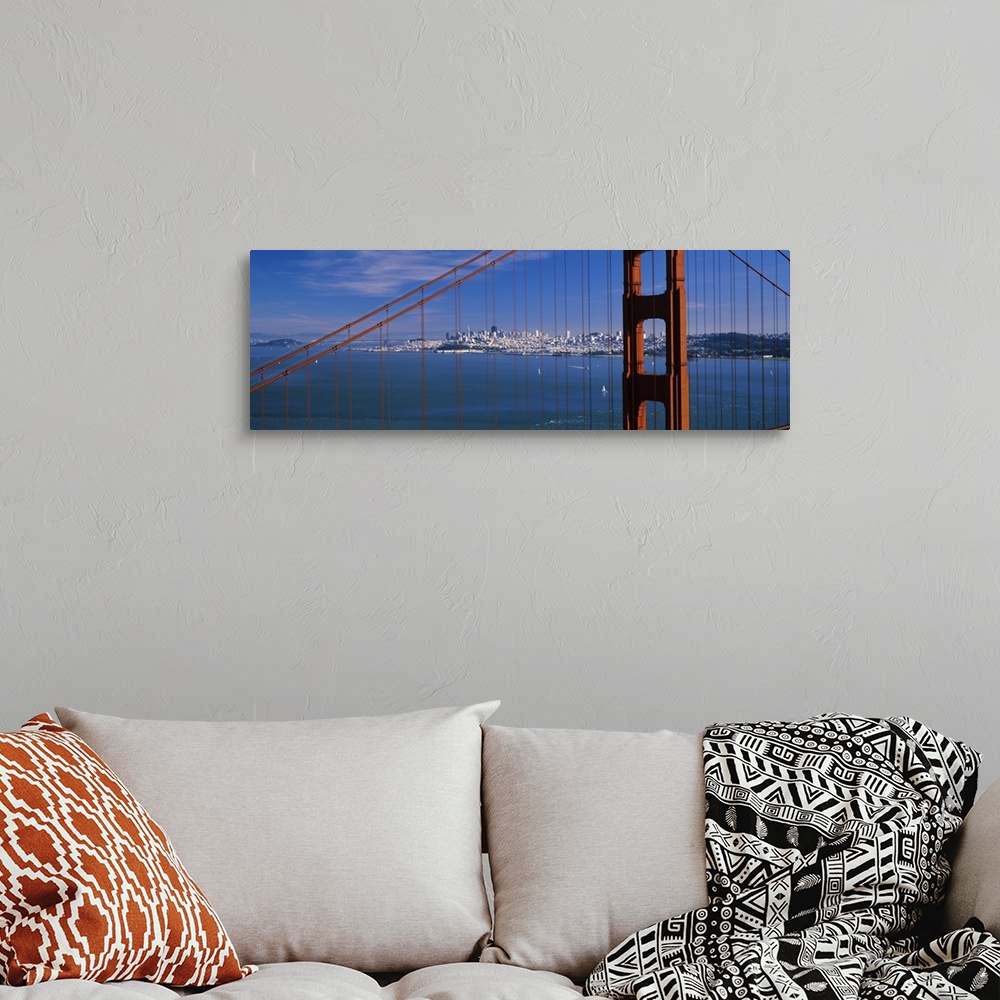 A bohemian room featuring Suspension bridge with a city in the background, Golden Gate Bridge, San Francisco, California,