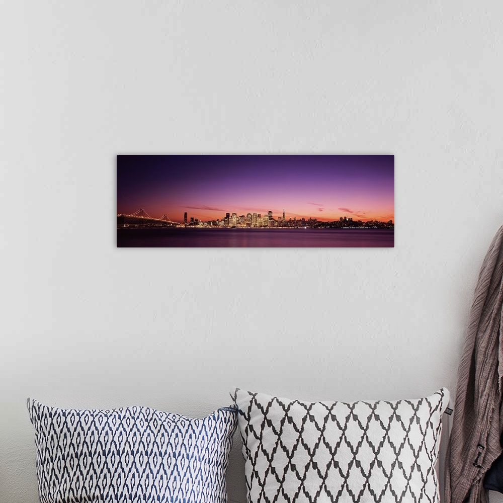 A bohemian room featuring Dusk panoramic photo looking across the San Francisco Bay at the buildings lit up in downtown San...