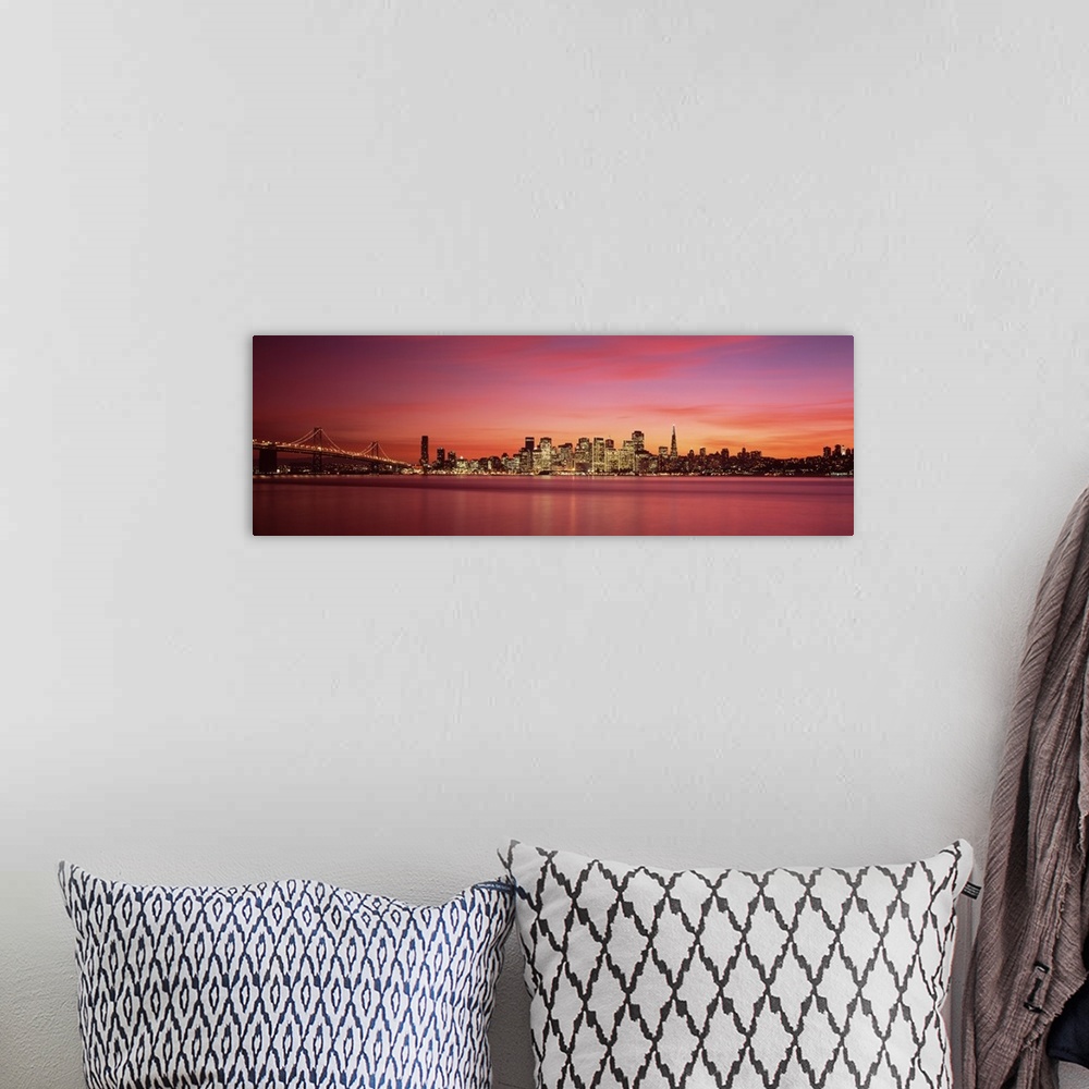 A bohemian room featuring Cityscape in the evening with lights on the skyscrapers as the sunlight fades away with wispy pin...