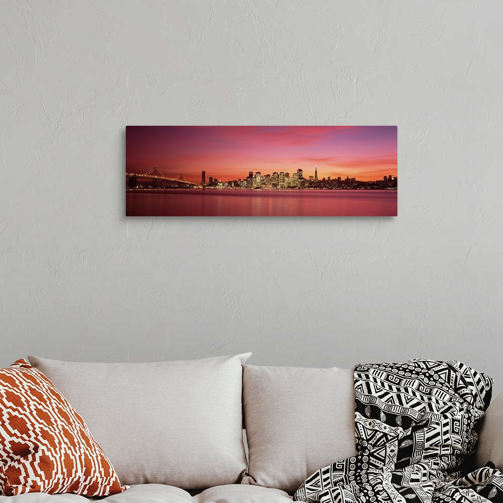 A bohemian room featuring Cityscape in the evening with lights on the skyscrapers as the sunlight fades away with wispy pin...