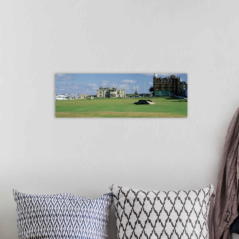 A bohemian room featuring Panoramic photograph on a large canvas of the green and buildings at the Swilcan Bridge, Royal Go...