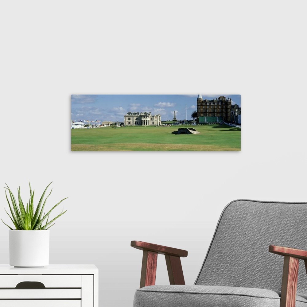 A modern room featuring Panoramic photograph on a large canvas of the green and buildings at the Swilcan Bridge, Royal Go...