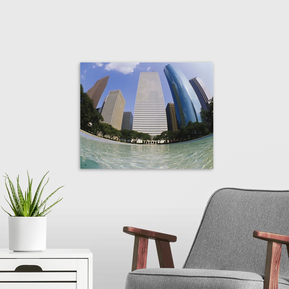 A modern room featuring Swimming pool in front of buildings, Houston, Texas