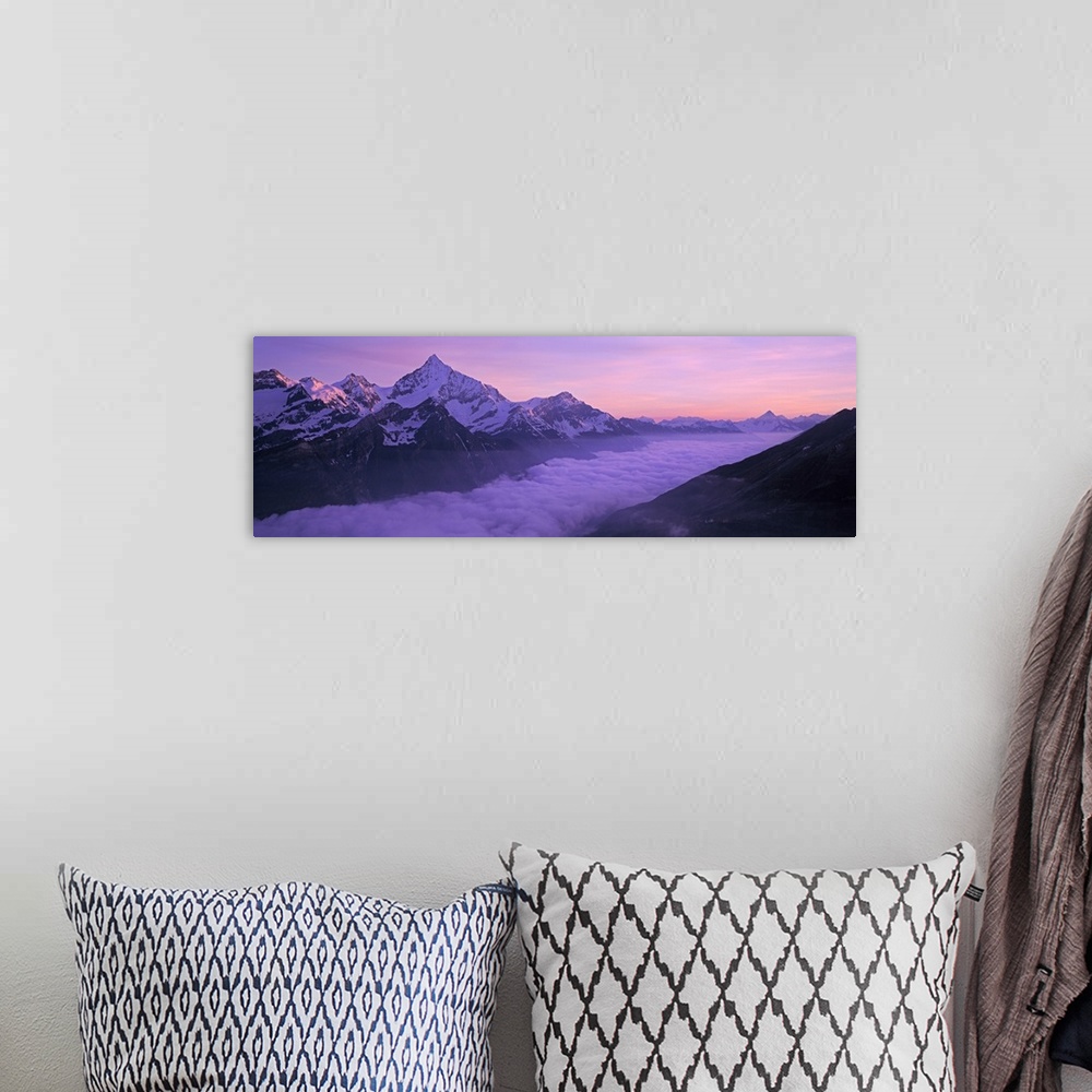 A bohemian room featuring Switzerland, Swiss Alps, Aerial view of clouds over mountains