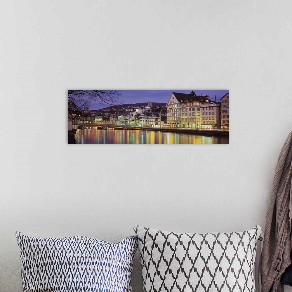 A bohemian room featuring Switzerland, Zurich, River Limmat, view of buildings along a river