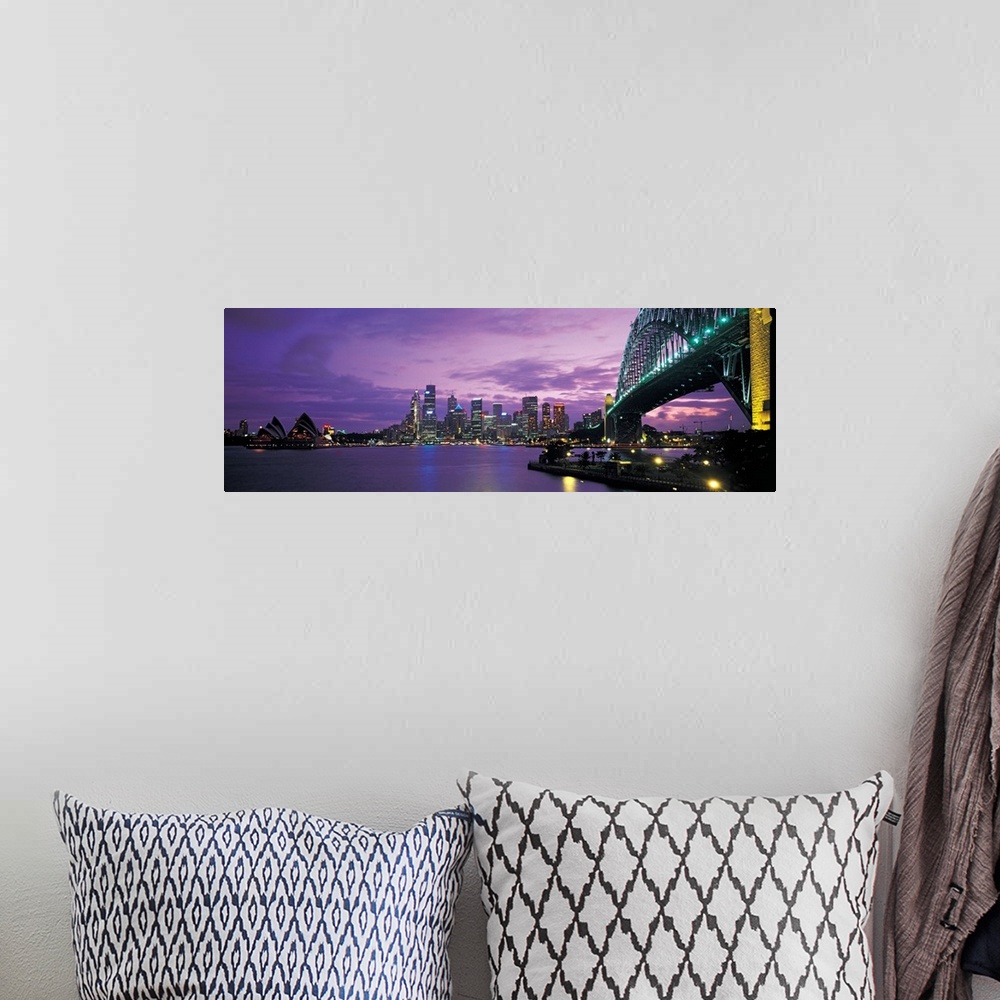 A bohemian room featuring Panoramic photograph of the Sydney skyline with a structure just seen to the right of the picture...