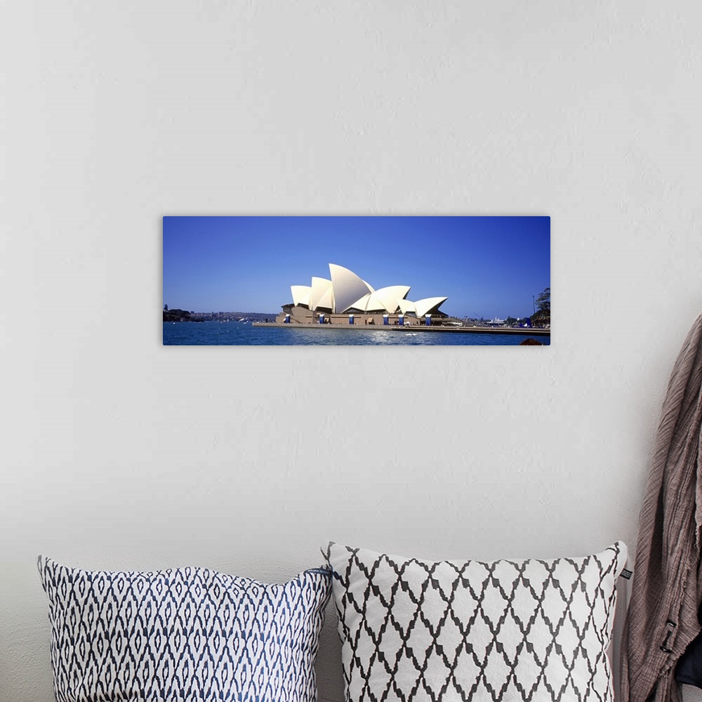 A bohemian room featuring Panorama of the Sydney Opera House in front of a blue Australian sky.