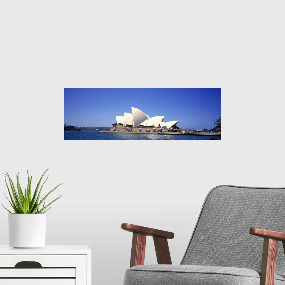 A modern room featuring Panorama of the Sydney Opera House in front of a blue Australian sky.