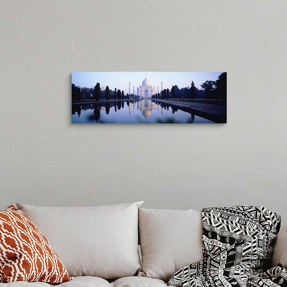 A bohemian room featuring Panoramic photo on canvas of the Taj Mahal with a reflecting pool in front.