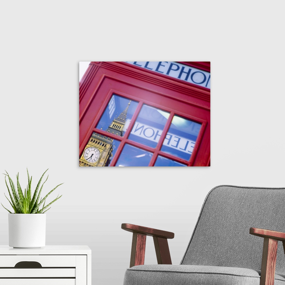 A modern room featuring Upclose photograph of a British telephone booth in London showing the reflection of Big Ben at th...