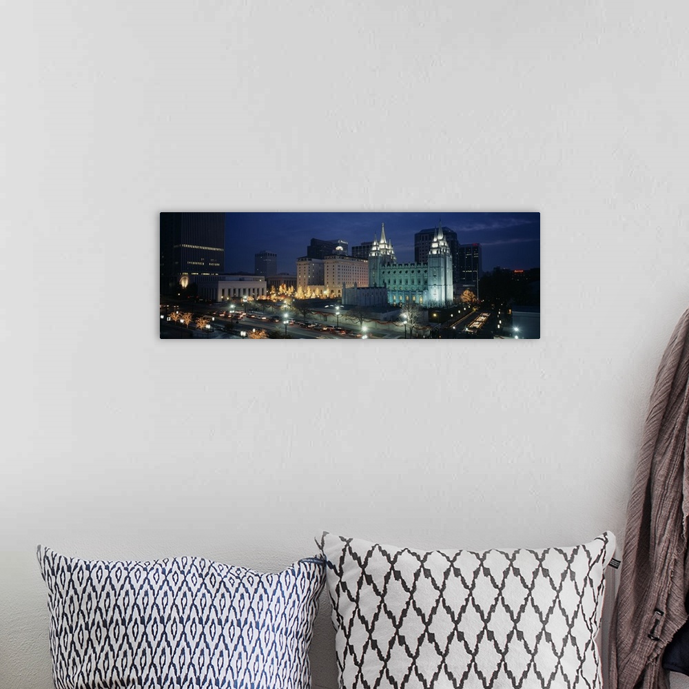 A bohemian room featuring Panoramic photograph of skyline glowing at dusk.