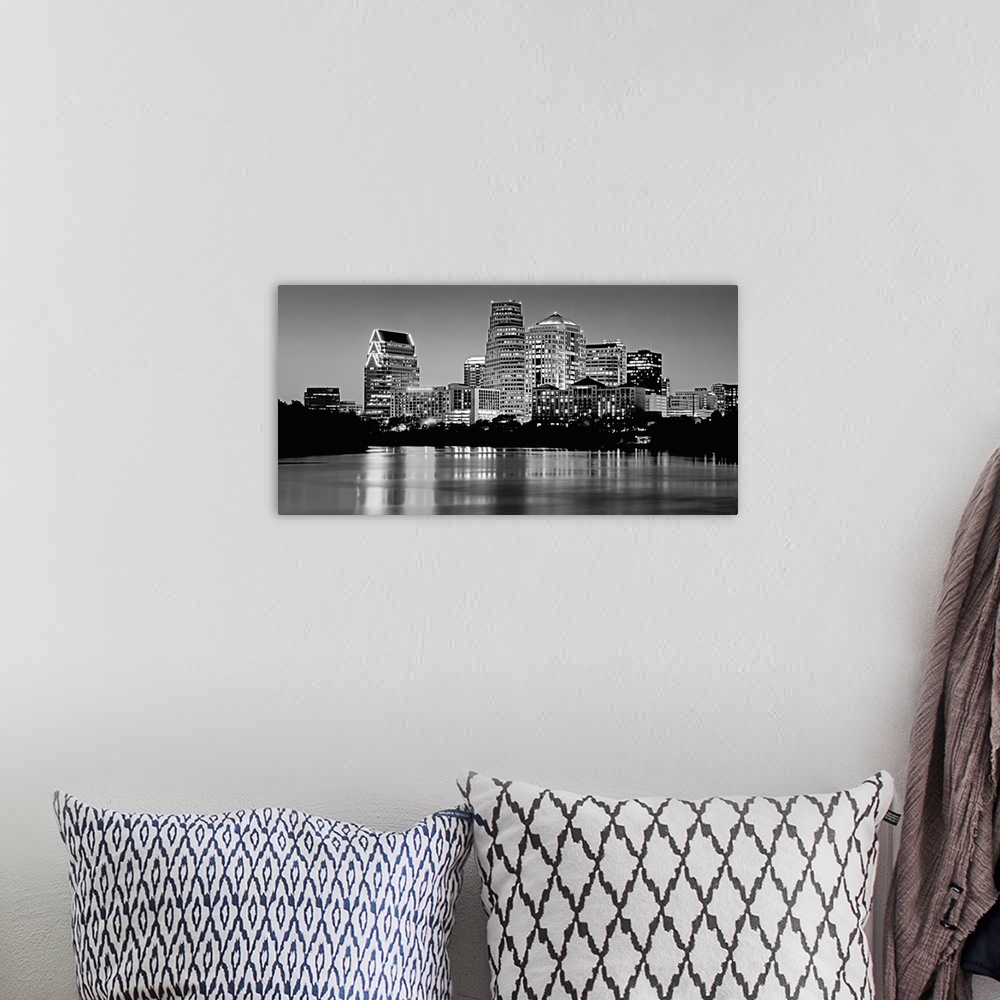 A bohemian room featuring Panoramic monochromatic photograph showcases the busy skyline of a famous city within the Southwe...