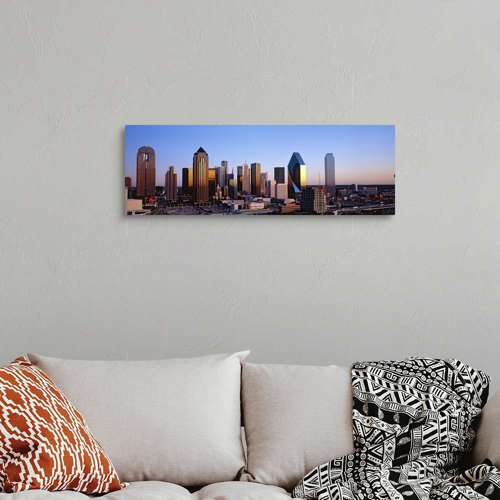A bohemian room featuring Oversized, panoramic photograph of the Dallas skyline at sunrise.