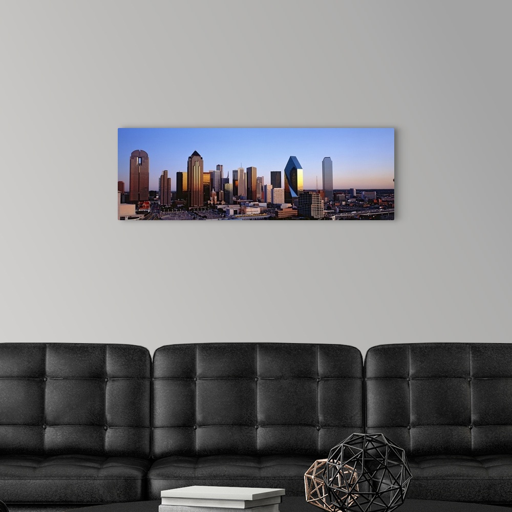 A modern room featuring Oversized, panoramic photograph of the Dallas skyline at sunrise.