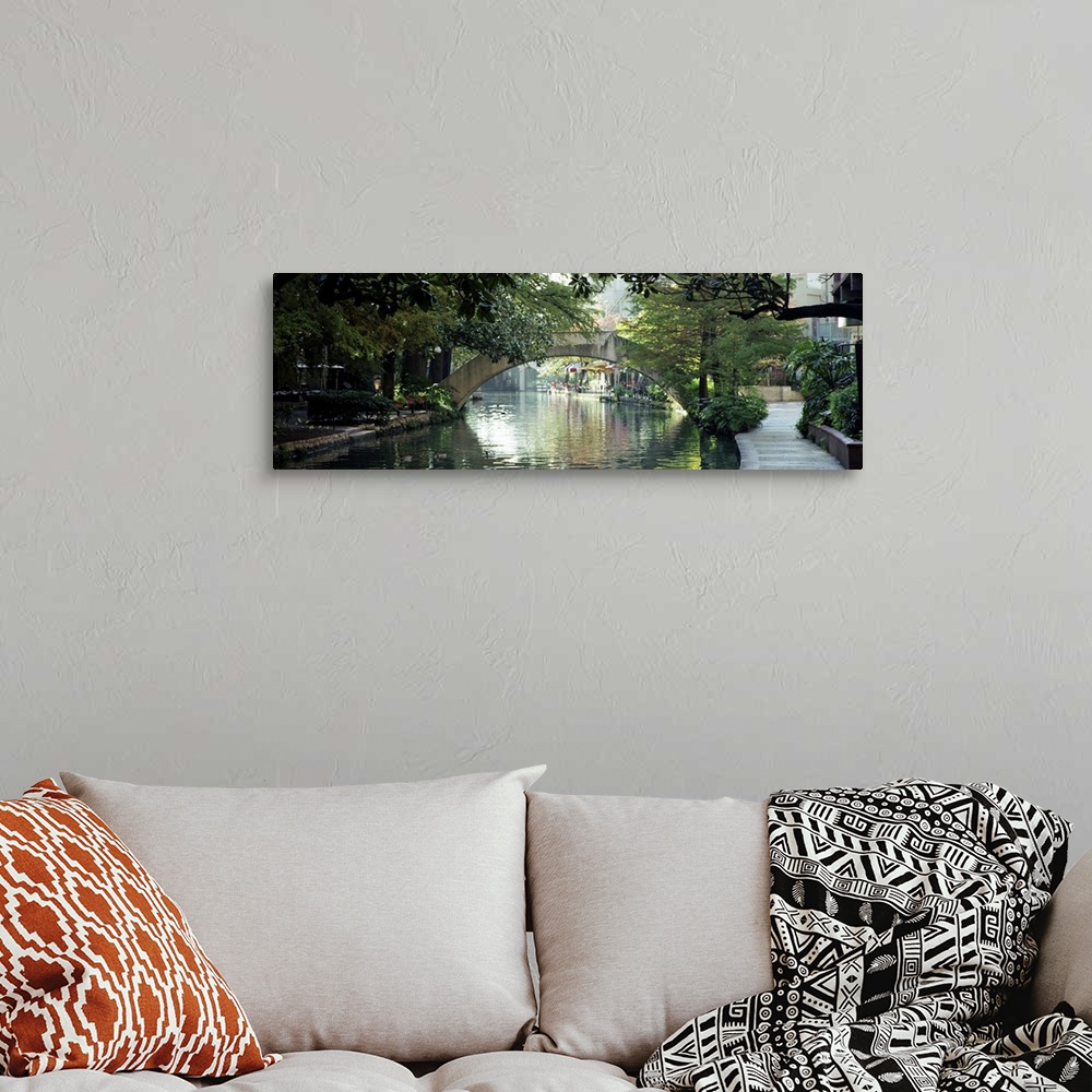 A bohemian room featuring Panoramic image of the canal in San Antonio with sidewalks, trees, and restaurants lining the wat...